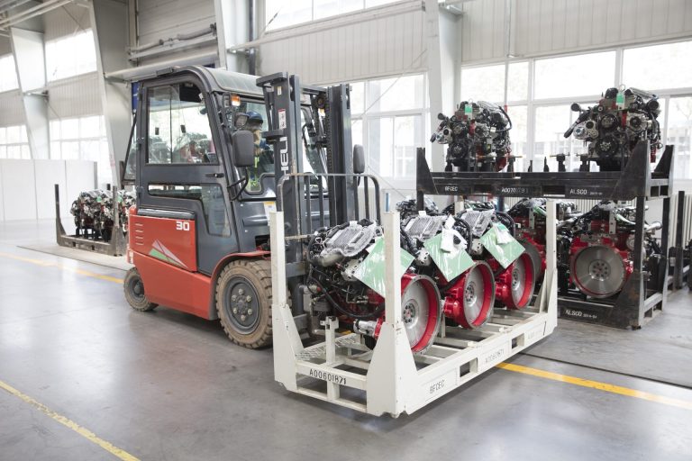 Forklift moving assembled FOTON Tunland engines and transmissions