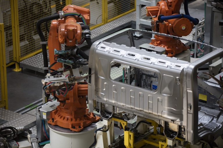 Robots welding a FOTON Tunland pickup cab shell